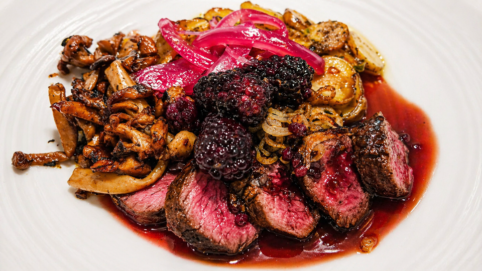 Kangaroo Fillet with Pommes Anna, Wild Mushrooms, and Blackberry Sauce