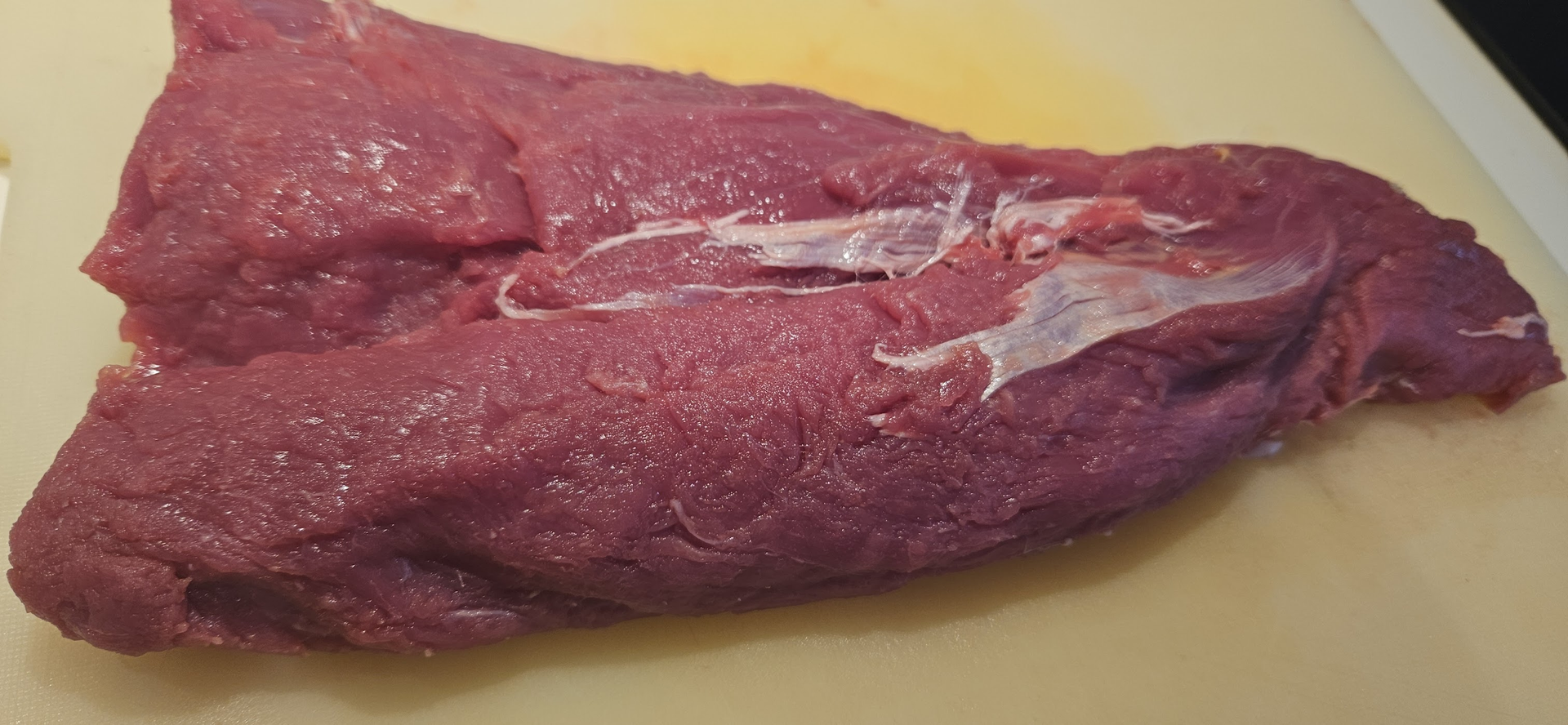 Portion the zebra meat and set aside the part that will go into the pot.